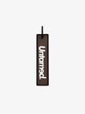 UNTAMED BROWN JET TAG