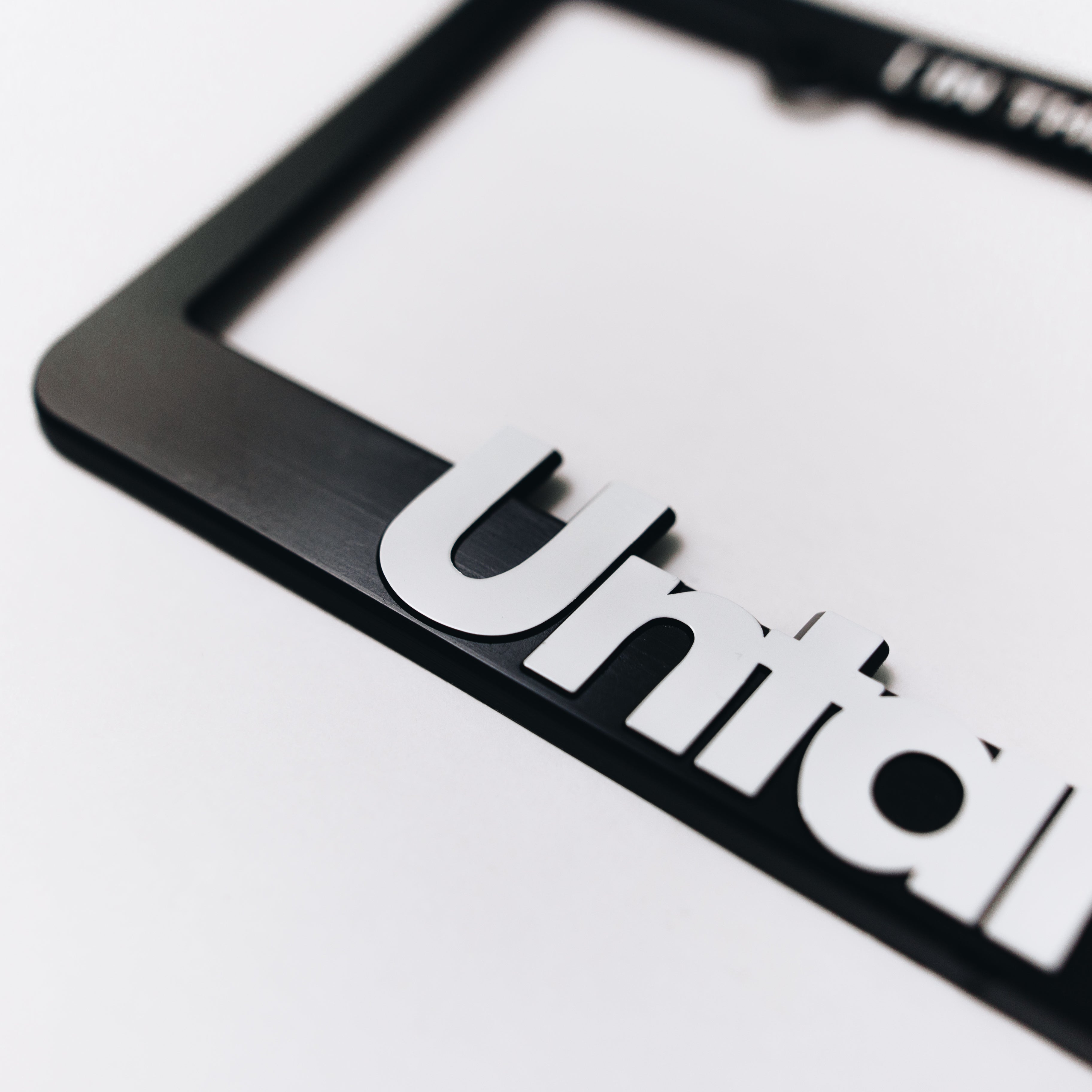 LICENSE PLATE FRAME [WHITE]